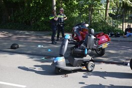 Bestuurder scootmobiel gewond na botsing met motor